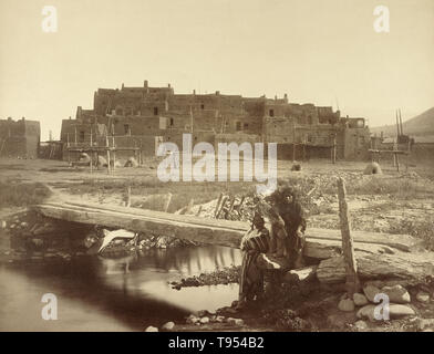 Pueblo de Taos, Northern New Mexico, Denver and Rio Grande Railway. William Henry Jackson (American, 1843 - 1942); 1880; Albumen silver print. Taos Pueblo (or Pueblo de Taos) is an ancient pueblo belonging to a Tiwa-speaking Native American tribe of Puebloan people. It lies about 1 mile north of the modern city of Taos, New Mexico, USA. The pueblos are considered to be one of the oldest continuously inhabited communities in the United States. This has been designated a UNESCO World Heritage Site. Stock Photo