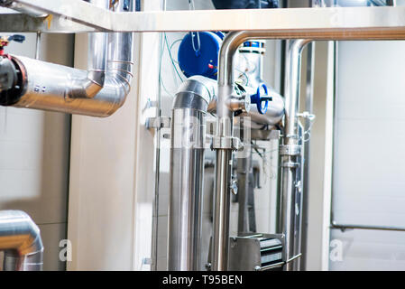 Stainless steel pipes in the factory. Construction on food production, Abstract industry background. Stock Photo