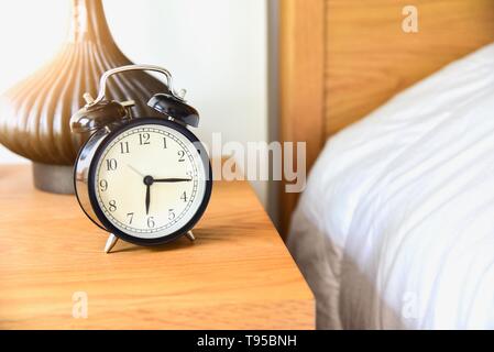 Vintage Morning Alarm Clock Isolated on Table Stock Photo