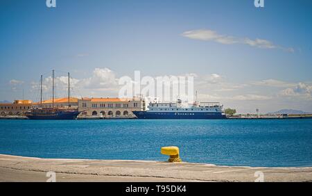 Ermoupolis: May 16th . Two ships moored in main Ermoupolis harbour. Syros , May 16th 2019, Greece. Stock Photo