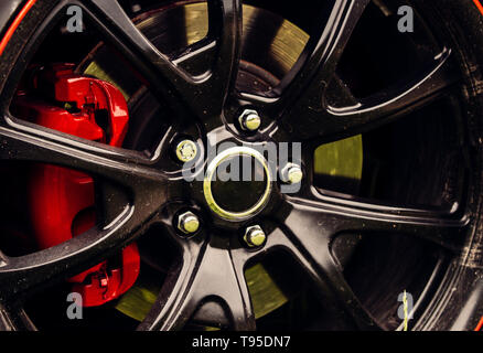 Drift inspired styling. Car wheel detail. Alloy wheel. Gloss black rim of luxury car wheel. Wheel and rim. Front or rear. Contemporary multi spoke Stock Photo