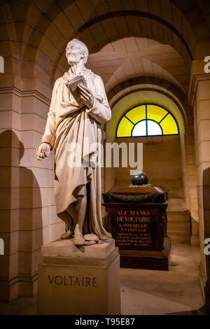 Paris, France - 24.04.2019: Voltaire's tomb and statue in the crypt of the Pantheon in Paris, France Stock Photo