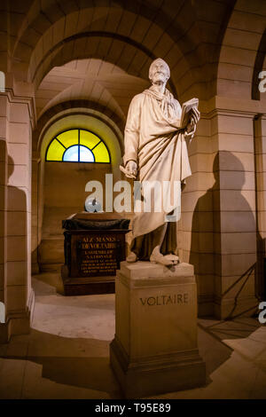 Paris, France - 24.04.2019: Voltaire's tomb and statue in the crypt of the Pantheon in Paris, France Stock Photo