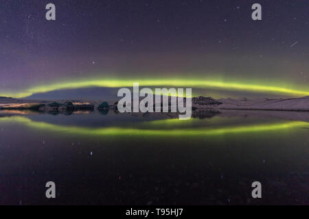 Aurora Borealis over Jokulsarlon lagoon in Iceland Stock Photo