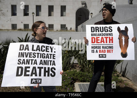 Los Angeles, CA, USA. 14th Mar, 2019. Demonstrators are seen holding placards during the protest.Animal right activists held a PETA protest against the death of 22 horses at the Santa Anita Racetrack. The protesters holding placards also called on the Los Angeles District Attorney to open a criminal investigation and suspend racing while investigating the cause of the death. Credit: Ronen Tivony/SOPA Images/ZUMA Wire/Alamy Live News Stock Photo