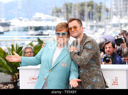 (190516) -- CANNES, May 16, 2019 (Xinhua) -- Producer Elton John and actor Taron Egerton pose during a photocall for the film Rocketman screened in the Hors Competition section during the 72nd Cannes Film Festival in Cannes, France, May 16, 2019. (Xinhua/Zhang Cheng) Stock Photo