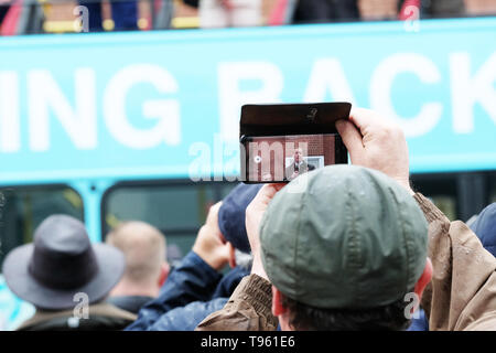 Dudley, West Midlands, England, UK - Friday 17th May 2019 – A member of the public films Nigel Farage as he speaks to the public from his battle bus during the Brexit Party tour event at Dudley, West Midlands ahead of next weeks European Parliament elections – The town of Dudley voted 67% in favour of leaving the EU in the 2016 referendum. Photo Steven May / Alamy Live News Stock Photo