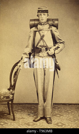 Unidentified Confederate soldier, standing, in uniform. Albumen silver print, c. 1862 - 1865. Stock Photo