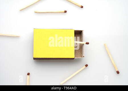 Matches made of natural wood for fire yellow boxes, on a white background, the concept of security. Stock Photo