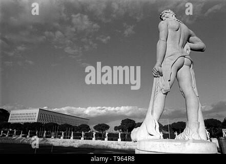 Rome, Italy: Marble statues of 'Stadio dei Marmi' and the Italian Foreign Office 'La Farnesina'. Stock Photo