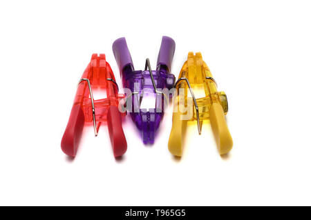 Clothes pegs.Clothespins for hanging and drying clothes in different colors.Clothes line.On an isolated white background. Stock Photo