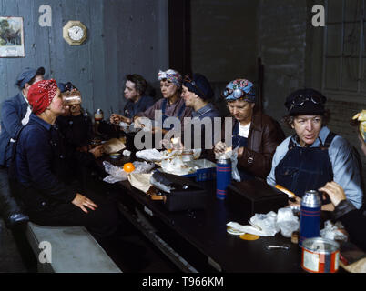 Women workers employed as wipers in the roundhouse having lunch in their rest room, C. & N.W. R.R., Clinton, Iowa. Although the image of "Rosie the Riveter" reflected the industrial work of welders and riveters, the majority of working women filled non-factory positions in every sector of the economy. What unified the experiences of these women was that they proved to themselves, and the country, that they could do a man's job and could do it well. Photographed by Jack Delano, 1943. Stock Photo