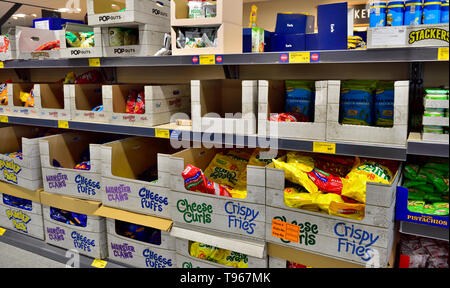 Supermarket shelves full of snack food Stock Photo