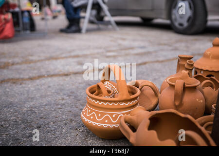 Close up of a market for handmade ceramic pots. Flower delves, painted ceramics. Shallow depth of focus. Stock Photo