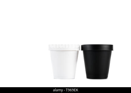 White and black plastic cups isolated on white Stock Photo