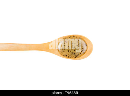 Scrubbing honey and coffee mixture on body in hot sauna helps open the pores and renew, rejuvenate the skin on body. Sauna treatment. Wooden spoon wit Stock Photo
