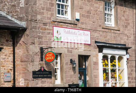 Sign above Post Office building at Dunsop Bridge Forest of Bowland Lancashire England UK.Puddleducks Tea Room at the Centre of the United Kingdom Stock Photo