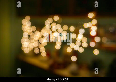 Abstract background with christmas decorations of glowing light bulbs designs Stock Photo