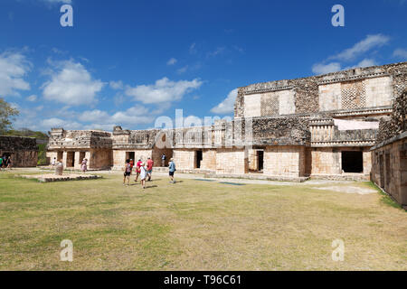 Mexico tourism - tourists in the Nunnery Quadrangle, part of the ancient 8th century Mayan city and UNESCO world heritage site, Uxmal, Mexico travel Stock Photo