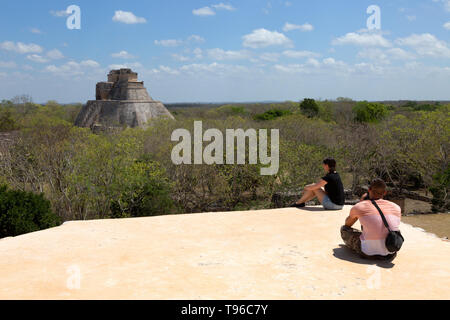 Mexico travel - a couple on holiday at Uxmal UNESCO world heritage site Mayan ruins, Uxmal Mexico Latin America Stock Photo