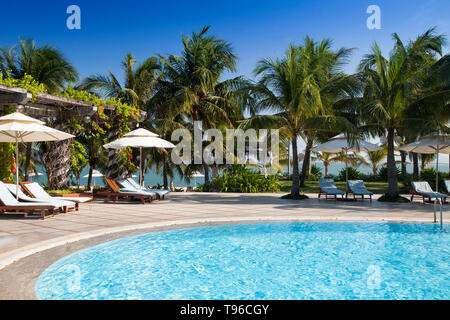 Swimming pool of Saigon Ninh Chu Resort on Phan Rang Beach,south china sea, Ninh Thuan, Vietnam Stock Photo