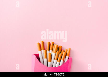 top view of cigarettes packed in paper box Isolated On pink with copy space, french fries concept Stock Photo