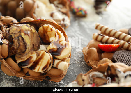 Delicious sweet bubble waffle on grey table Stock Photo