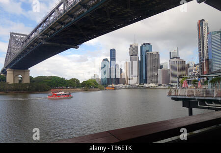 Ferry passing underneath Story Bridge from Howard Smith Wharves (Felon Brewing Co), Brisbane, Queensland, Australia. no PR Stock Photo