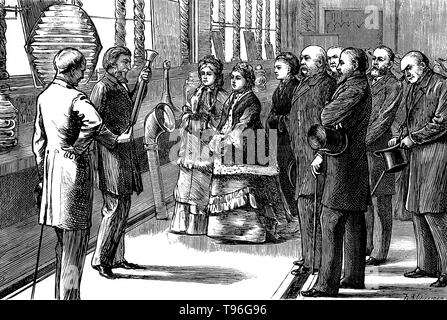 Tyndall demonstrating a fog-horn to Queen Victoria and her entourage. John Tyndall (August 2, 1820 - December 4, 1893) was an Irish physicist and medical educator. Beginning in the late 1850s, Tyndall studied the action of radiant energy on the constituents of air.  In 1893 he died from an accidental overdose of chloral hydrate. He was 73 years old. Engraving by Theodore Blake Wirgman, 1876. Stock Photo