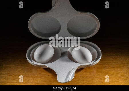 microwave two egg cooker with two cooked eggs Stock Photo - Alamy