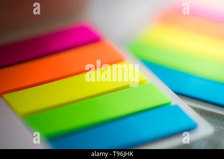 blurred background multicolored notes in a notebook Stock Photo
