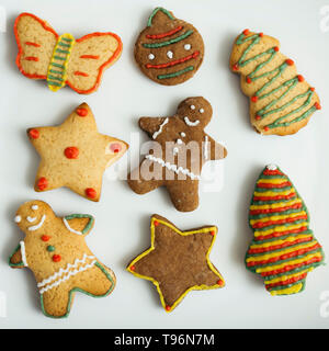 decorated gingerbread cookies on white plate Stock Photo