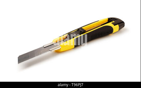 Yellow stationery knife isolated on white background Stock Photo