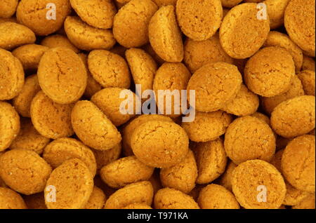 Background of Pepernoten, typical traditional Dutch cookie-like treat, associated with the early December Sinterklaas holiday in the Netherlands . Stock Photo