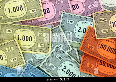Colorful Monopoly board game cash background. Stock Photo