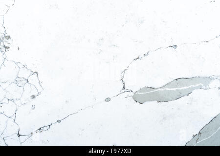 Flat background slate of polished marble used for construction, or a backdrop design. Marble pattern is mostly white, black and grey. Stock Photo