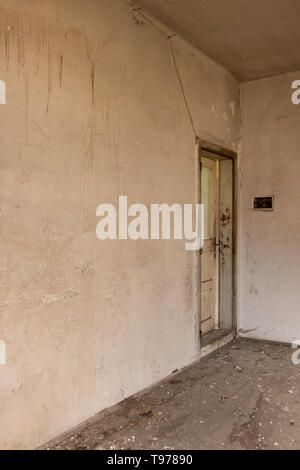 damaged door in old building Stock Photo