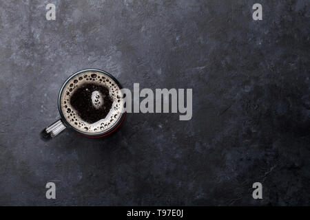 Glass of dark porter beer on stone table. Top view flat lay with copy space Stock Photo