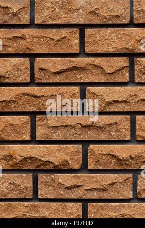 wallpaper texture light textured brick stone wall filling the entire frame Stock Photo