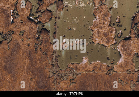 Rusty brown iron texture, green old fence with stains and peeling paint. Textured wallpaper for design. Stock Photo