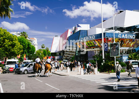 CANNES,FRANCE-MAY,16,2019: police woman on a horse patrols the street around the palais du cinema,during the film festival 72th edition Stock Photo