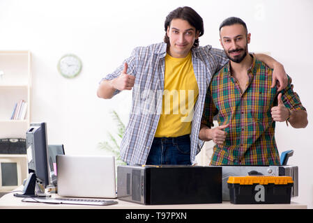 IT engineers working on hardware issue Stock Photo