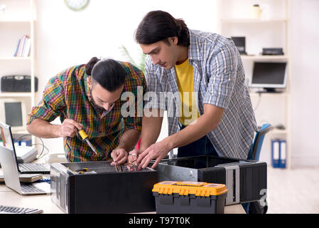 IT engineers working on hardware issue Stock Photo