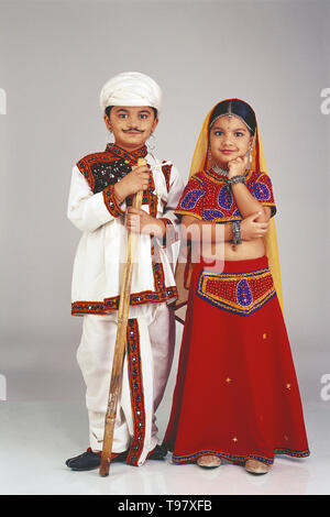 portrait of a couple from gujarat in traditional costume these are children aged 12 who are dressed up as adults