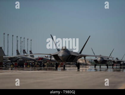 An F-22 Raptor taxis on the flightline during the Combat Archer 19-8 exercise at Tyndall Air Force Base, Florida, May 14, 2019. Combat Archer 19-8 allowed leaders to monitor the life span of a missile to assess execution performance by maintenance crew members, aircraft armament systems members and aircrew members. (U.S. Air Force photo by Airman 1st Class Monica Roybal) Stock Photo