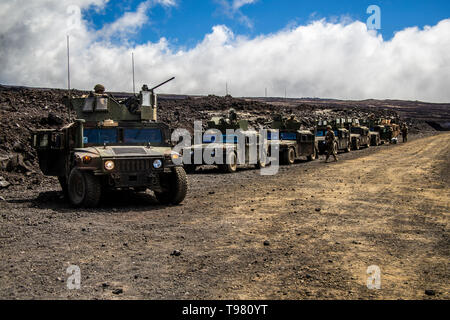 U.S. Marines with Combined Anti-Armor Team, Weapons Company, 2nd Battalion, 3rd Marine Regiment, prepare for movement during Exercise Bougainville II on Range 20A, Pohakuloa Training Area, Hawaii, May 15, 2019. Bougainville II is the second phase of pre-deployment training conducted by the battalion in order to enhance unit cohesion and combat readiness. (U.S. Marine Corps photo by Lance Cpl. Jacob Wilson) Stock Photo