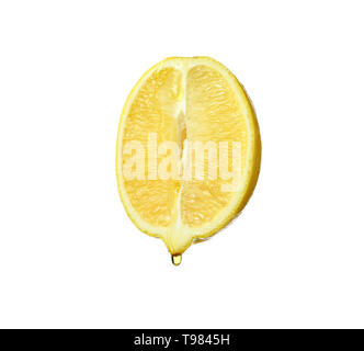 Essential oil dripping from lemon cut on white background Stock Photo