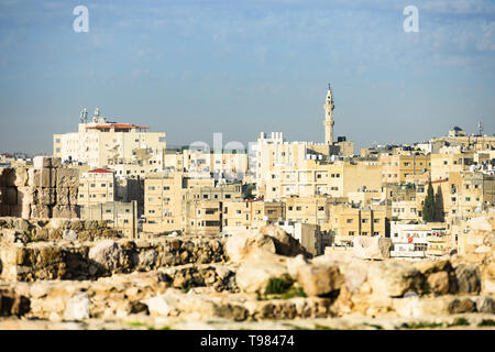 (Selective focus) Stunning view of the Amman skyline seen from the Amman Citadel in Jordan with a mosque in the distance. Stock Photo