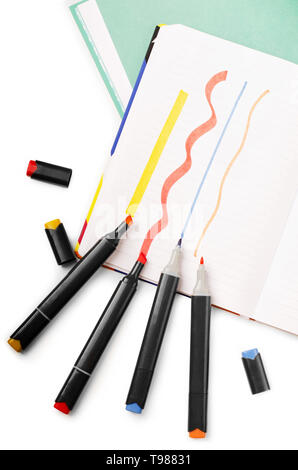 Notebook with marker or felt-tip marker pen on a white background Stock Photo