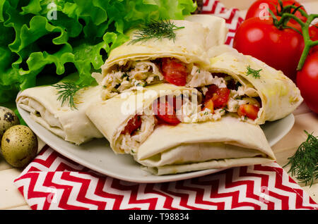 Wrap sandwich with tomatoes, quail eggs and cheese Stock Photo